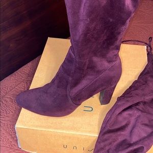 Knee high purple heeled boots